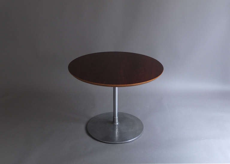 With a cast aluminum pedestal and a rosewood round top.
Designed by Pierre Paulin, edited by Artifort.
 