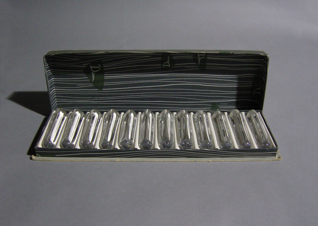 A set of 12 fine French Art Deco crystal knife rests by Daum with their original box.