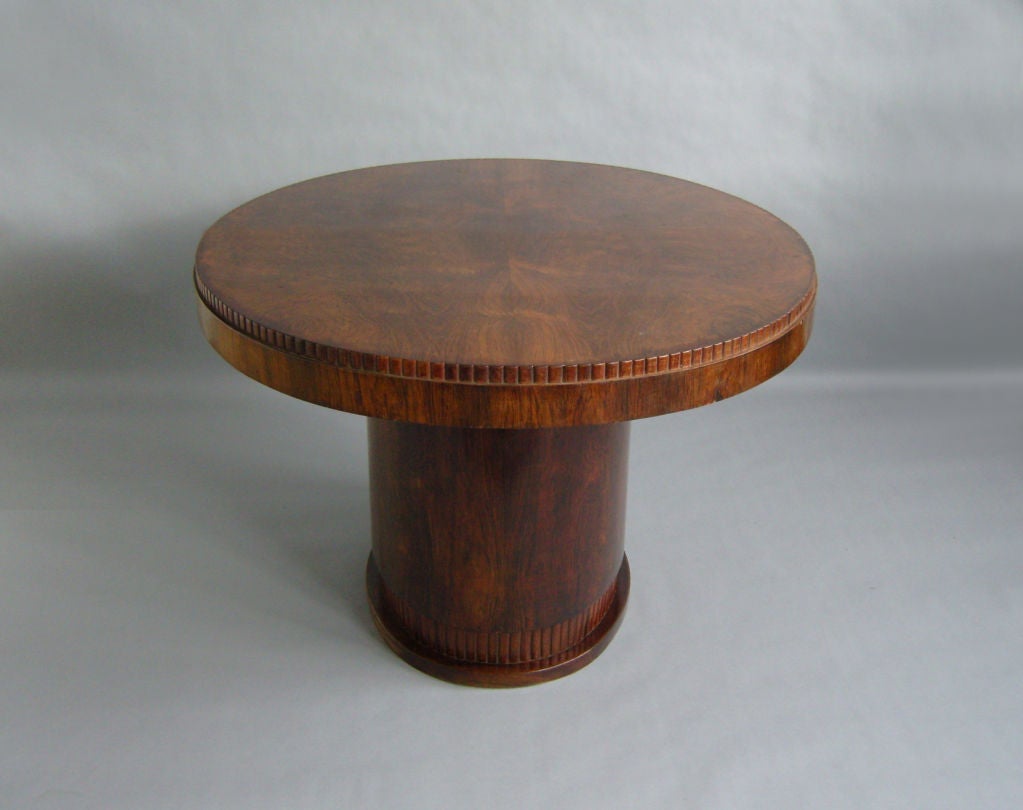 Fine French Art Deco rosewood oval dining or center table.
Possibility of center extension leaves.
Dimensions of the base are 29 1/2