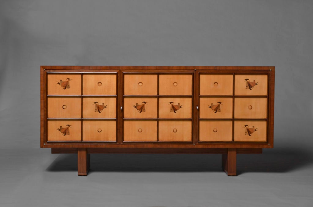 A fine French Art Deco walnut and sycamore 3 doors buffet with marquetry details.
The matching table is also available.
