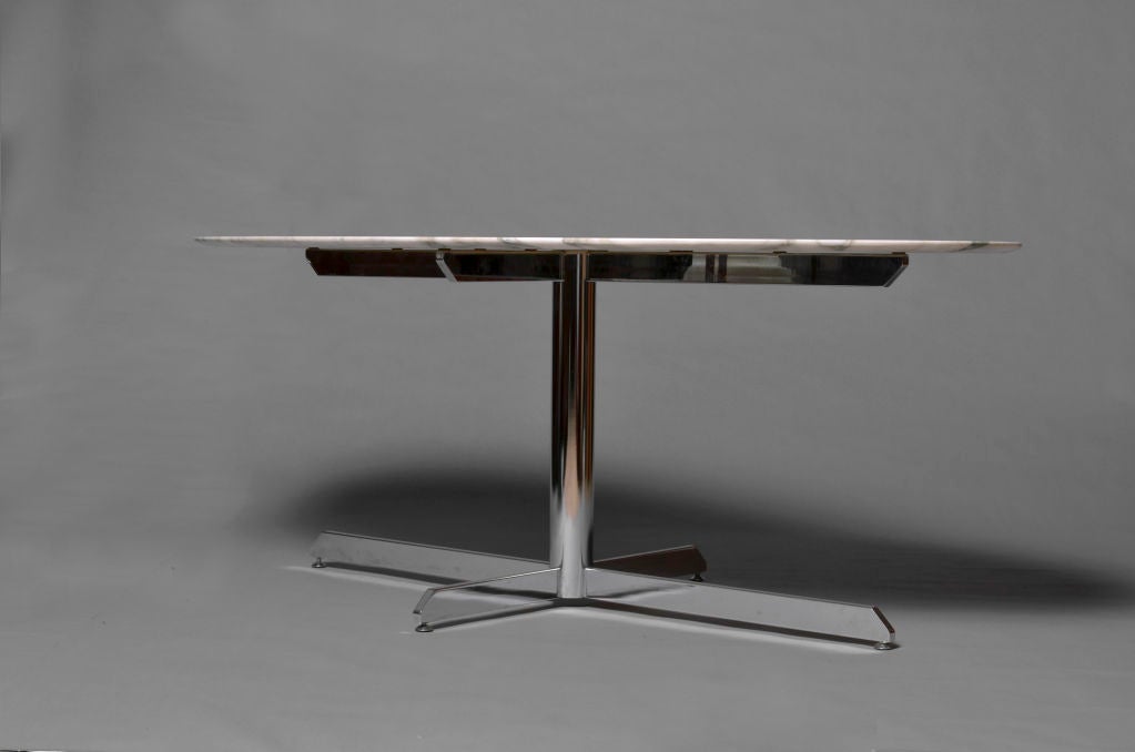 French 1970's chromed base oval table with a marble top.<br />
Edited by Roche Bobois, France.