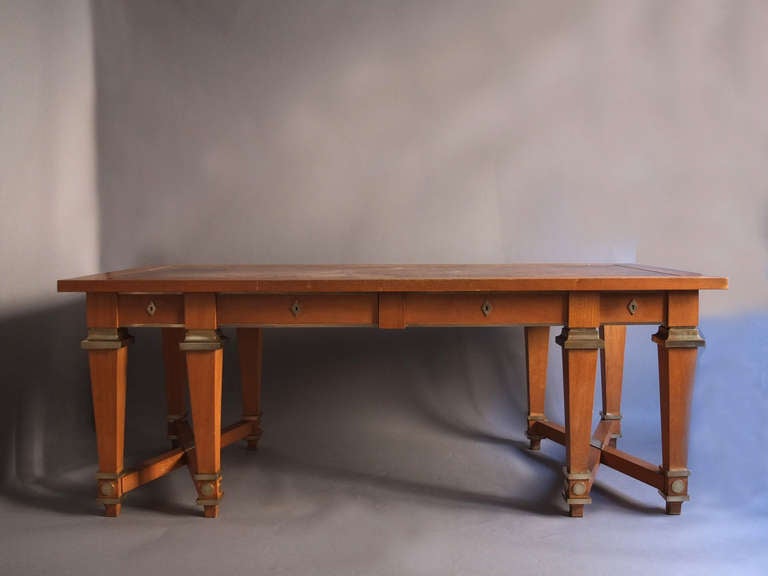 Fine French Art Deco light mahogany desk, library table attributed to André Arbus with four drawers, a leather covered top and high quality bronze details.
3 visitor arms are available, (see pictures).