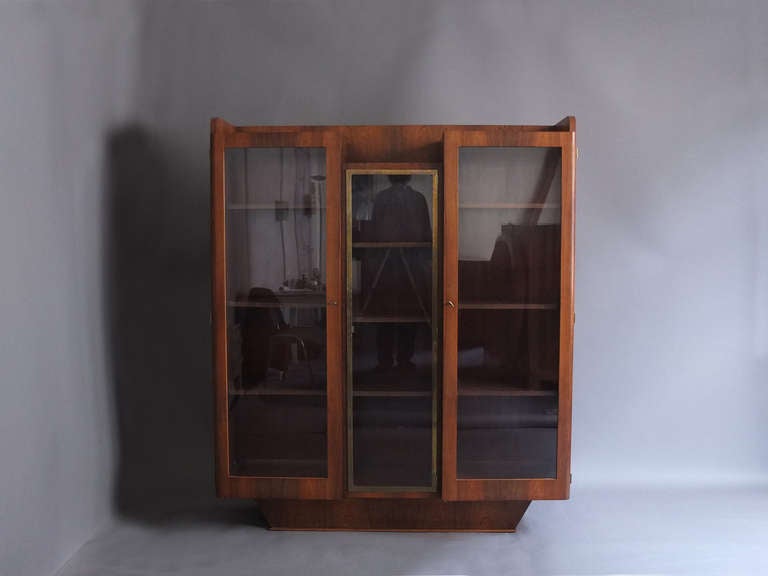 Fine French Art Deco rosewood 3 doors bookcase or display cabinet with a brass framed center door.
Shelves are adjustable.
 