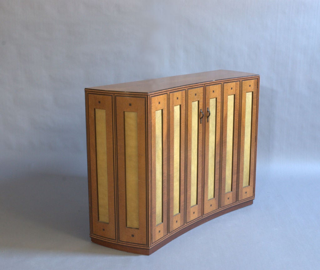 A fine and unusual bird's-eye maple cabinet / console table / dresser with some  recessed leather panels and metal handles. Signed (Unidentified.)
Dealer Ref: 734.
  