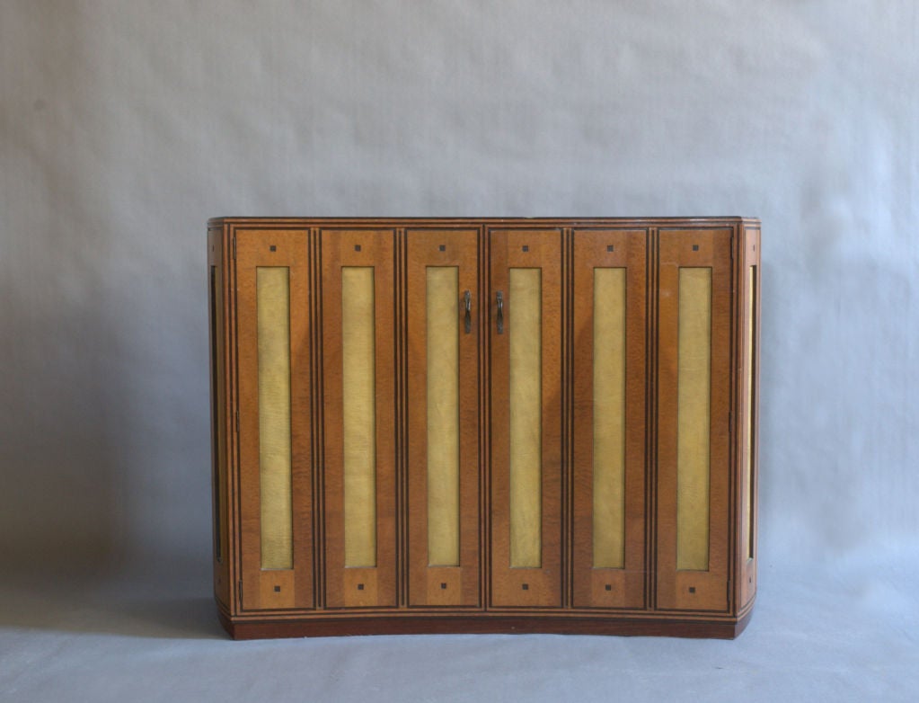 Mid-Century Modern A Fine Spanish Bird's-Eye Maple and leather Cabinet.