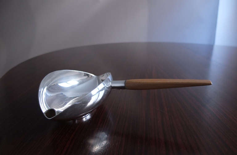 Silver plated sauce boat with a wooden handle by Lino Sabattini.