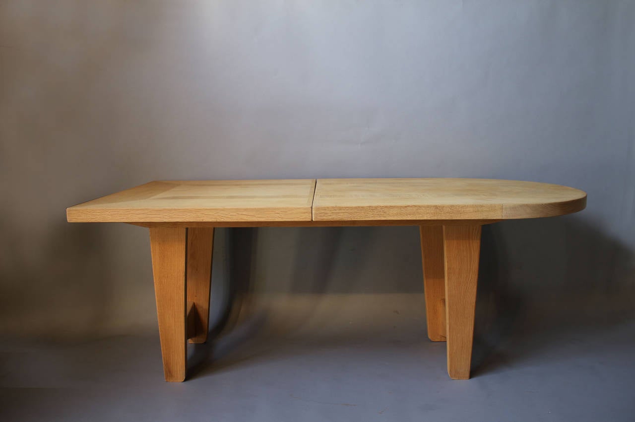French 1950's oak dining or writing table by Guillerme et Chambron with two original center leaves (length is 100