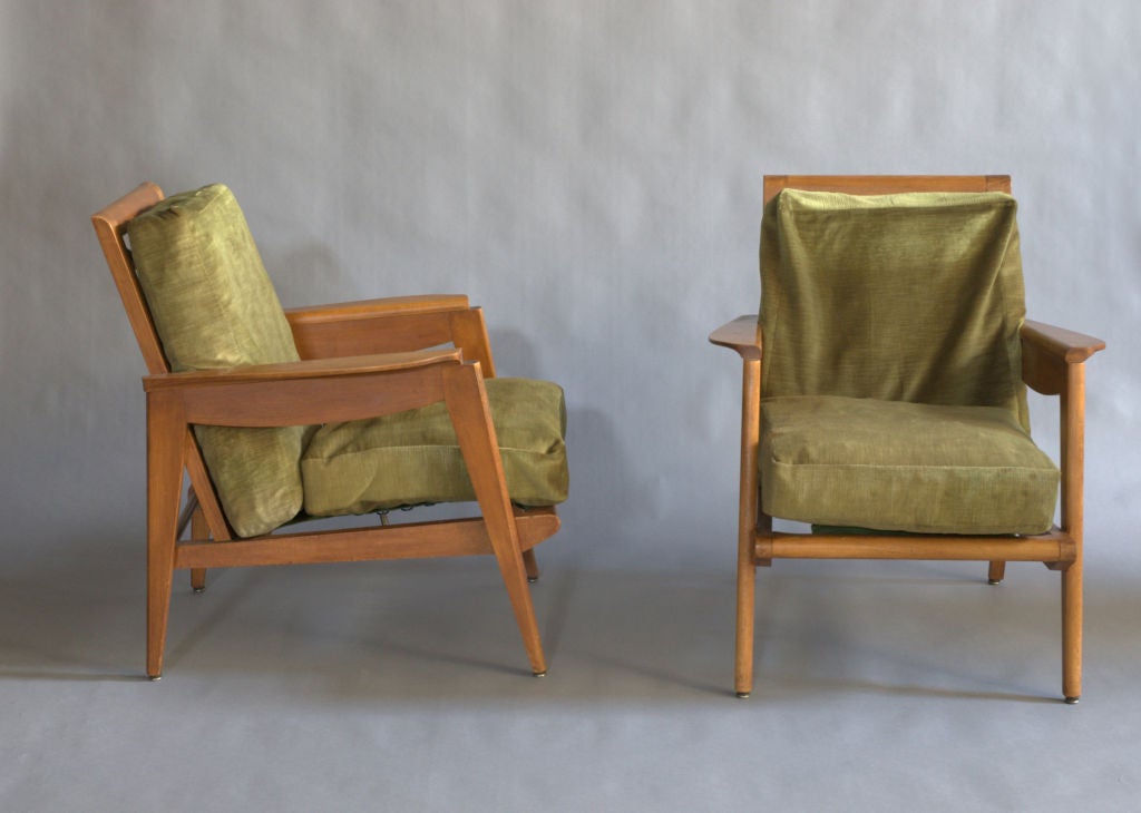 A pair of fine French 1950s stained beech wood armchairs.