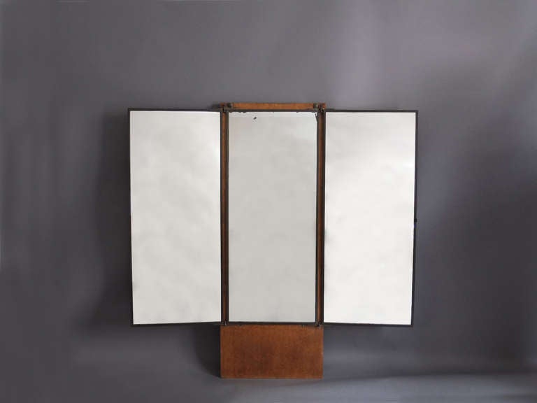 French Art Deco brass framed triptych mirror by Maison brot with Birds eye maple base and fabric screen.