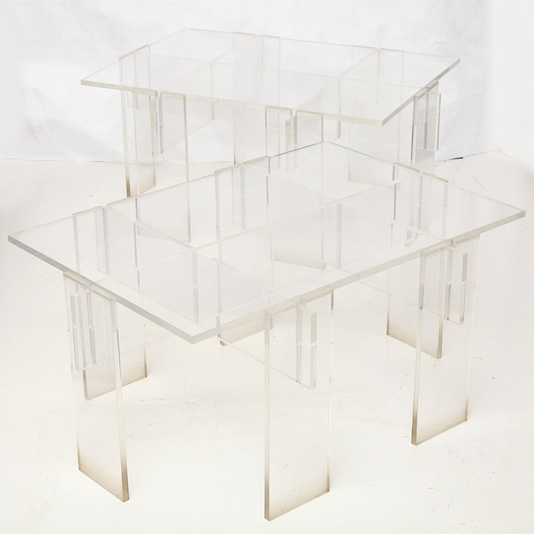 Pair of rectangular low tables consisting of ten interlocking Lucite “puzzle” pieces.
American, circa 1970.