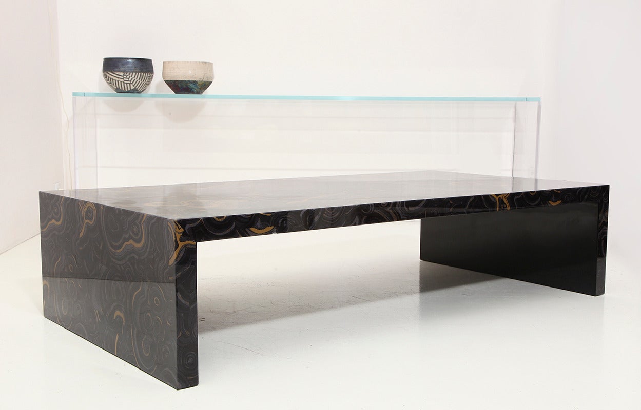 Fabric-wrapped low table with durable high gloss lacquer finish.
Comes in two sizes. Larger model shown here.
 
 “The perfect cocktail table, generous in proportion and simple in design. A great complement to a traditional sofa or a modern