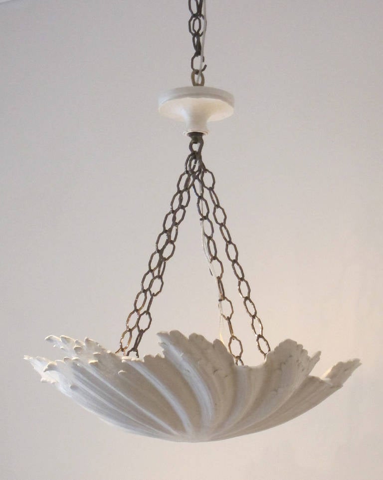W.P. Sullivan 
The shell chandelier
Sculpted shell form ceiling fixture in plaster resin.
Can also be with twisted ivory cord.
Can be hung singly or in tiers with additional sizes.
Made expressly for Liz O'Brien.

Shown in 26