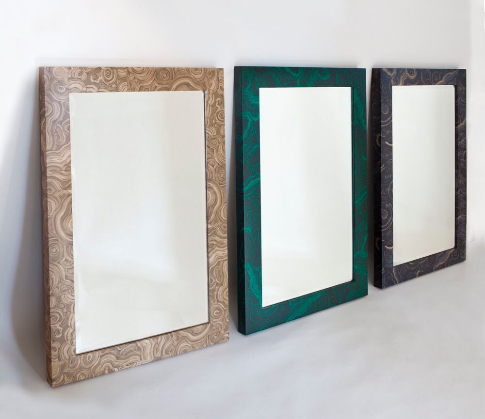 The Albert mirror
A fabric-wrapped frame with
Inset beveled glass mirror 
And satin lacquer finish.
Available in malachite, travertine, onyx and lapis color ways.


“The Albert mirror will add light and glamour to any room.” Liz O’Brien.