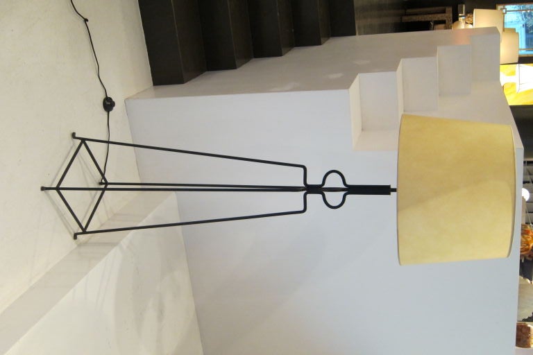 Wrought iron floor lamp in the designer's four-cornered 