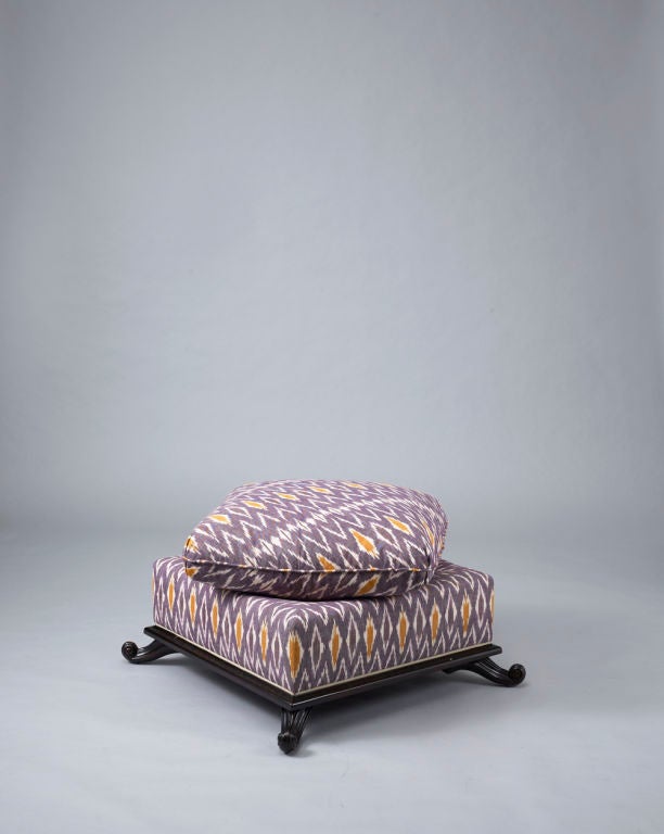 Liz O'Brien Editions Sister Pouf
Square form ottoman with semi-attached cushion with Turkish corner detailing. Intricately carved frame and scroll form feet. 

Available in seven specialty finishes. 4 yards of fabric required per pouf. Please allow