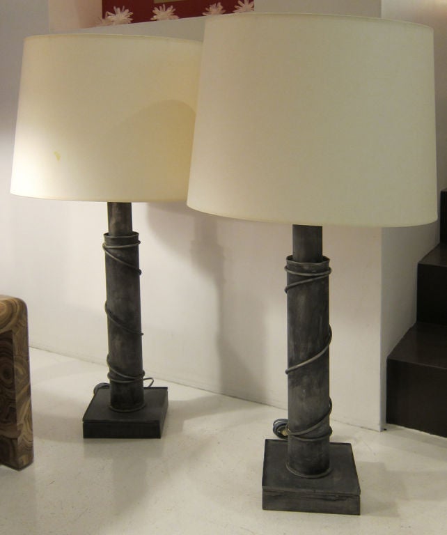 Pair of metal table lamps with column bases and wire decoration on a square base. <br />
Provenance: from the Estate of Katherine Elkins Boyd.