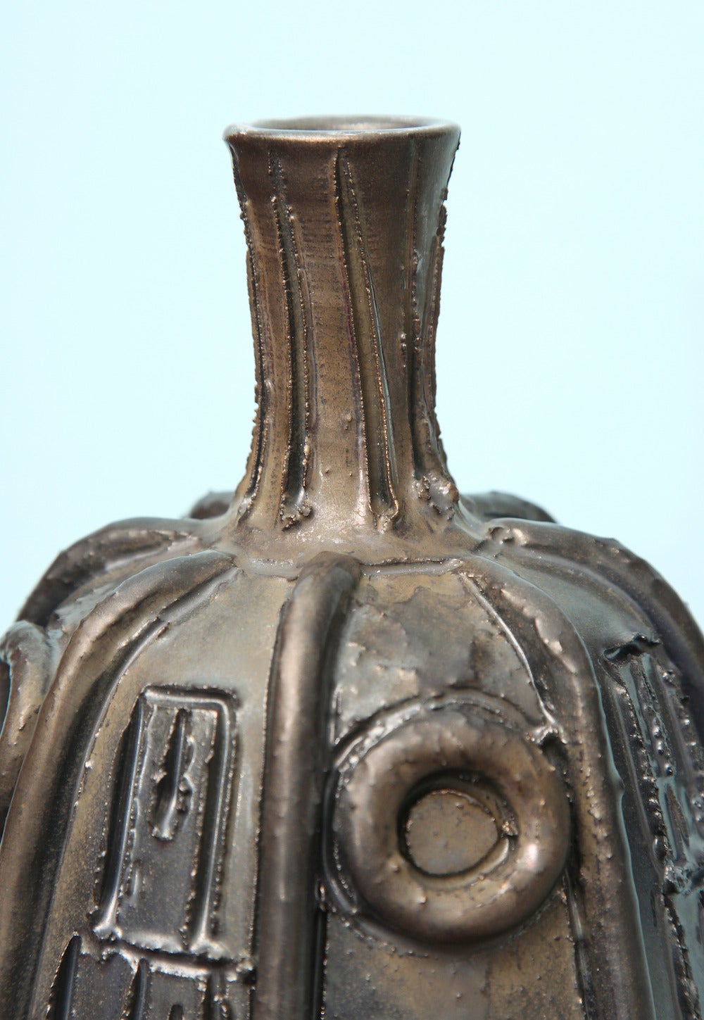 Super large and unusual bottle form with applied circles and incised decorations. Opaque glaze in gunmetal variations. Signed on underside.