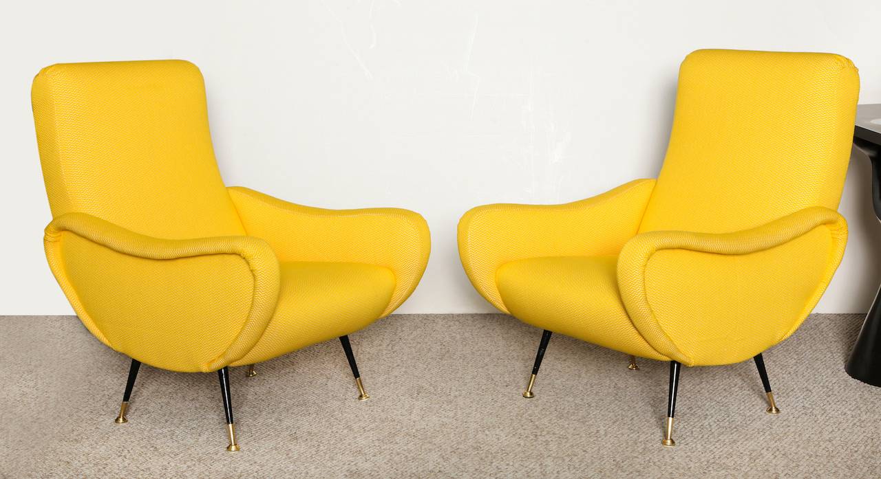 Beautiful chairs with sweeping lines and great proportions. Tapering legs of painted and polished brass. Vintage, handwoven Italian fabric in bright yellow.