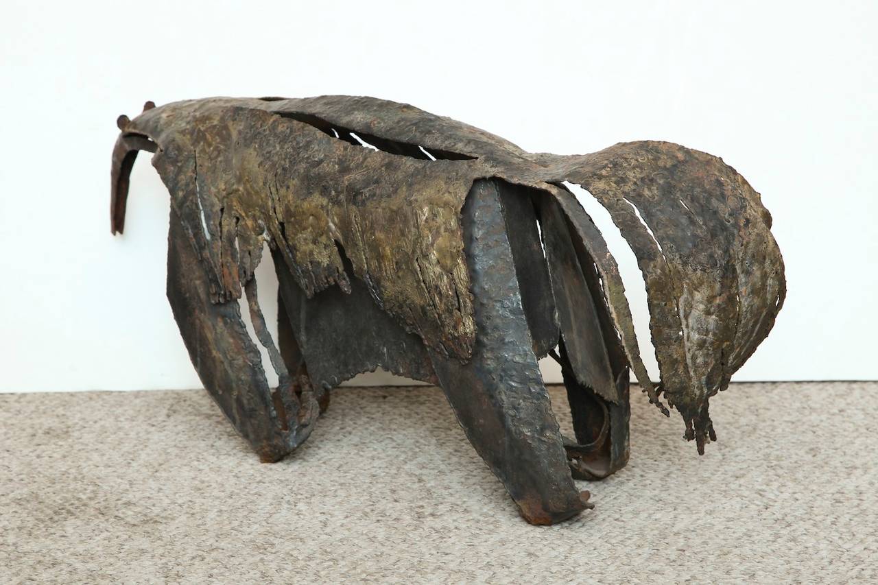 Studio-made, figural sculpture of heavy gauge sheet metal. Created by using a number of sculptural techniques, this piece has been torched, pierced, sliced, and has a lot of texture and detail. Great example of American craftsmanship.