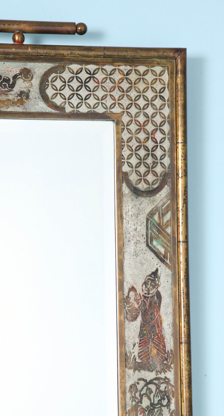 Rare asian style mirror by Philip & Kelvin LaVerne.  Bronze and pewter framed mirror with circular patterned corners and scenic decoration. Bright, colored enamel flourishes and Asian-styled top-piece. A very unusual model. Signed on frame.
