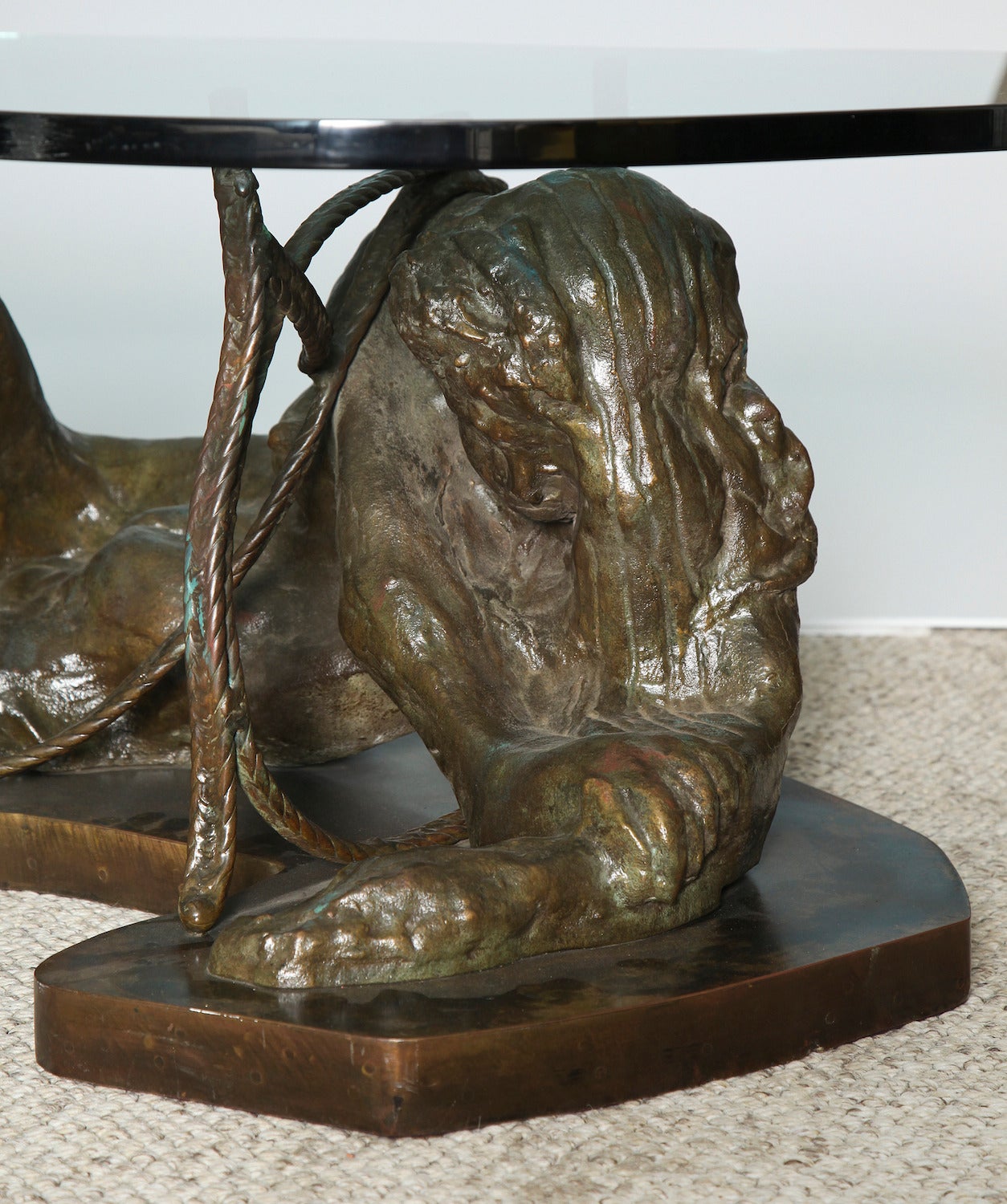  "Repose," rare studio table by Philip and Kelvin LaVerne Moody and beautiful cast-bronze sculpture in the form of a reclining woman on a shaped plinth. Entwining bronze rope surrounds the figure and supports a free-form glass top. Signed