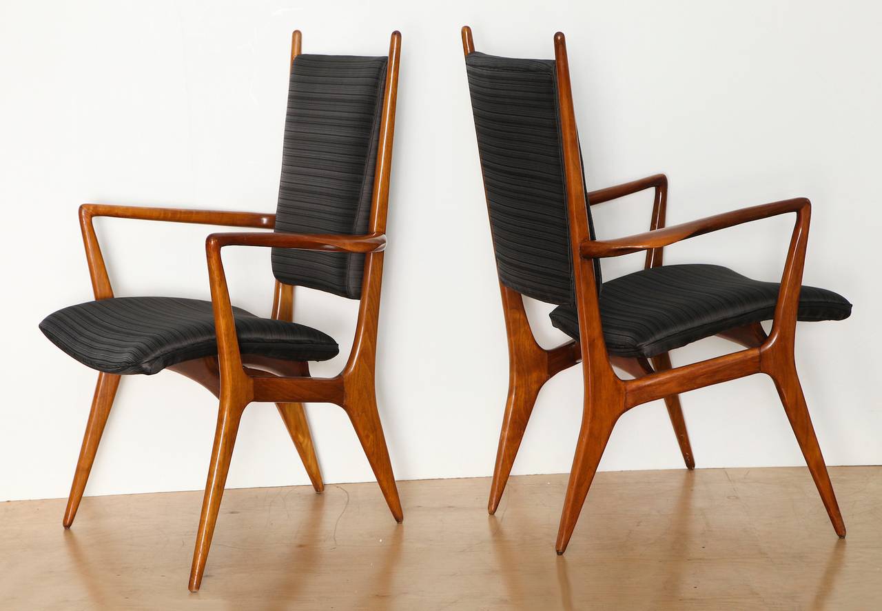 Rare pair of armchairs by Vladimir Kagan. Sculptural walnut frames, floating seats and upholstered backs. This rare pair has many of the attributes we love most about Kagan's work. A beautiful pair.
*A 2nd matching pair available.