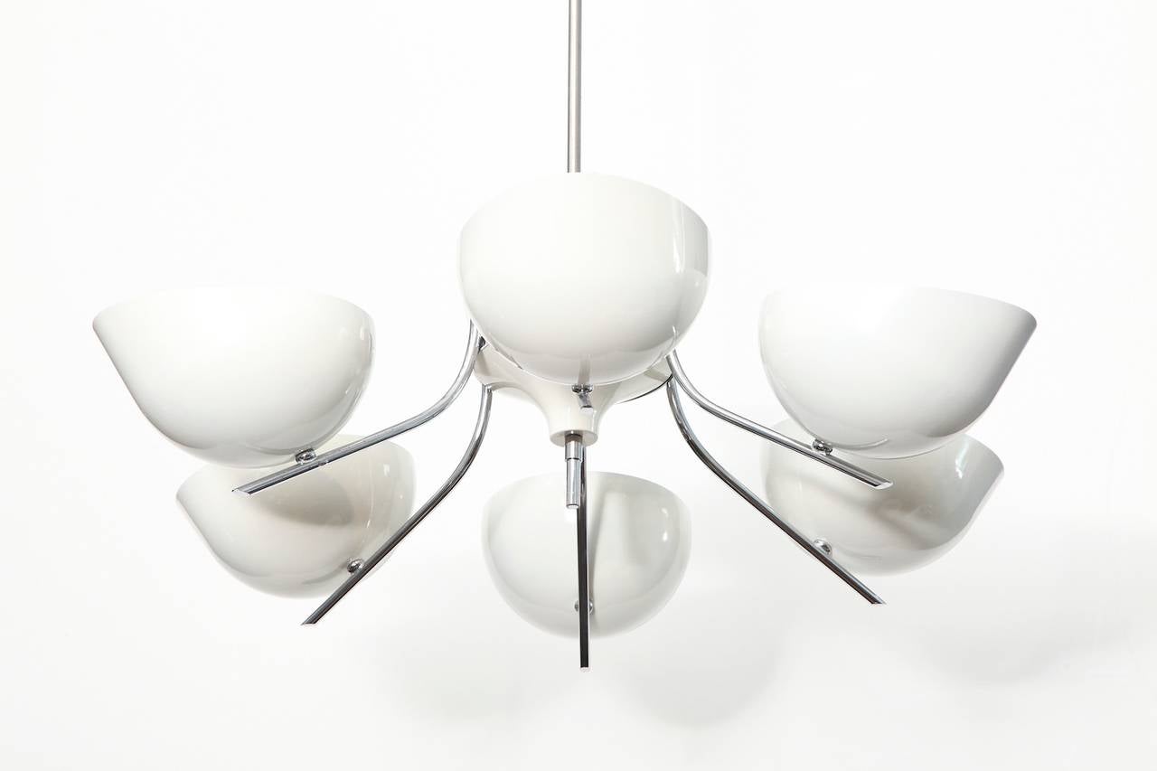 Studio made six arm hanging fixture by Richard Weissenberger. Unique ceiling light of chromed and white painted metal elements. This piece features six ovoid form reflectors, each concealing one candelabra socket. Weissenberger is a well known