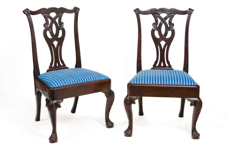 Pair of 18th century Irish mahogany side chairs on cabriole legs with carved shell on knees.