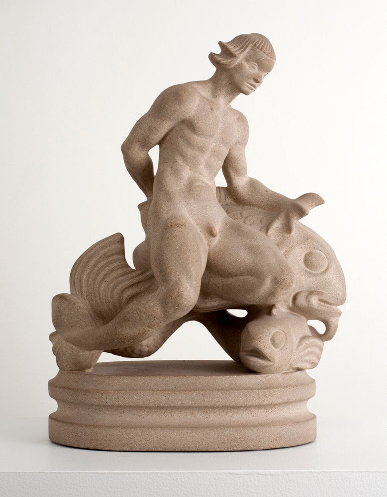 Beautiful sandstone sculpture of a merman by Just Andersen, made in Denmark, ca. 1940. It is in excellent condition.

Just Andersen was born in Greenland, studying at the Royal Academy in Copenhagen in 1910 and the School of Danish Crafts at 1912