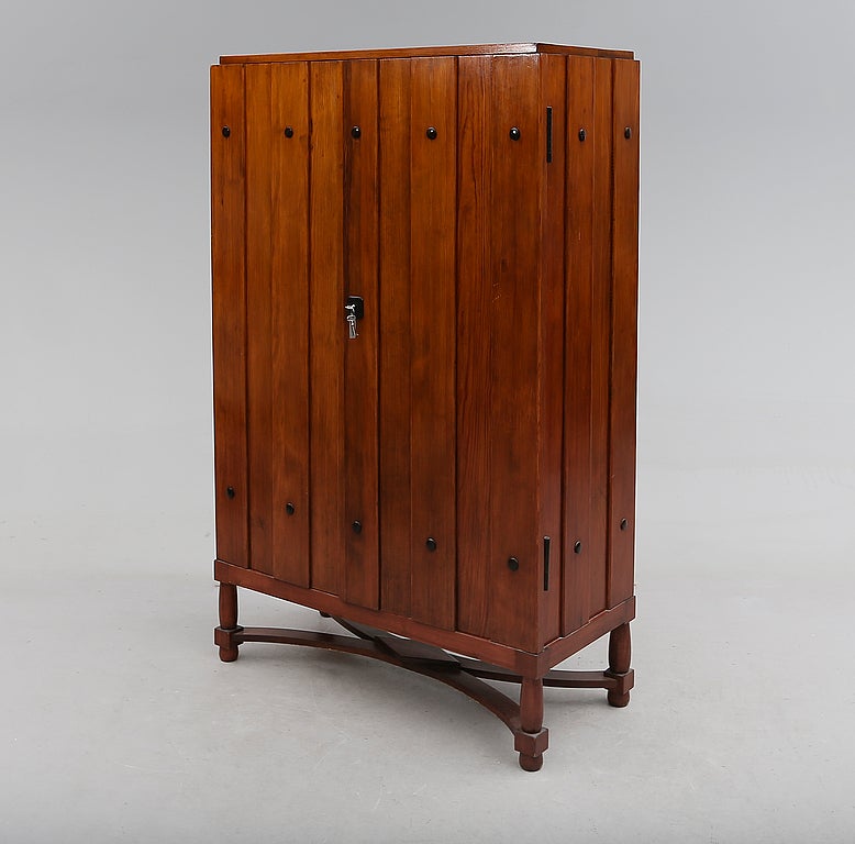 Exquisite cabinet by Hjorth in pine with iron details and rare base.
 
Axel Einar Hjorth.
Tall cabinet with two doors.
Northern European pine.
Nordiska Kompaniet,
Sweden, circa 1930.
Pine, iron details.
Measures: 39.5” W x 17.5” D x 63”