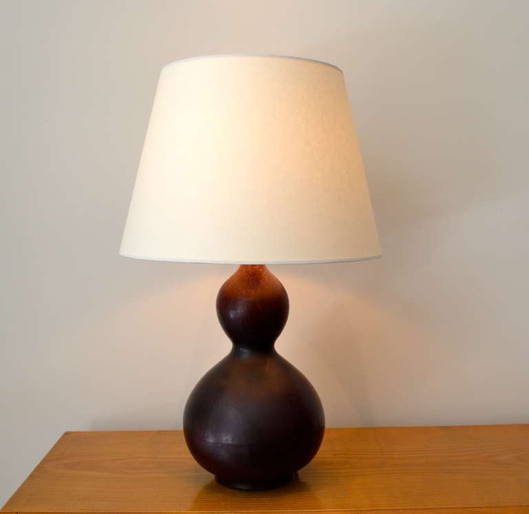 Beautiful double gourd lamp by Axel Salto.
Stoneware with oxblood glaze for Royal Copenhagen, Denmark, ca. 1955.
Artist signature with Royal Copenhagen marks.