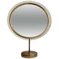 Mirror on brass stand by Josef Frank