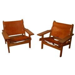 Pair of Danish lounge chairs in patinated leather and oak