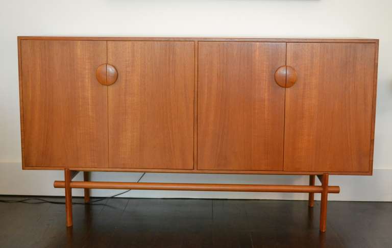 Beautiful teak credenza by Edvard and Tove Kindt - Larsen, Denmark, circa 1960.
Two-door cabinet opens up to combed oak interior with adjustable shelves and drawers.
Excellent condition.

Measures: 64.75" L x 18" D x 35.5" H.