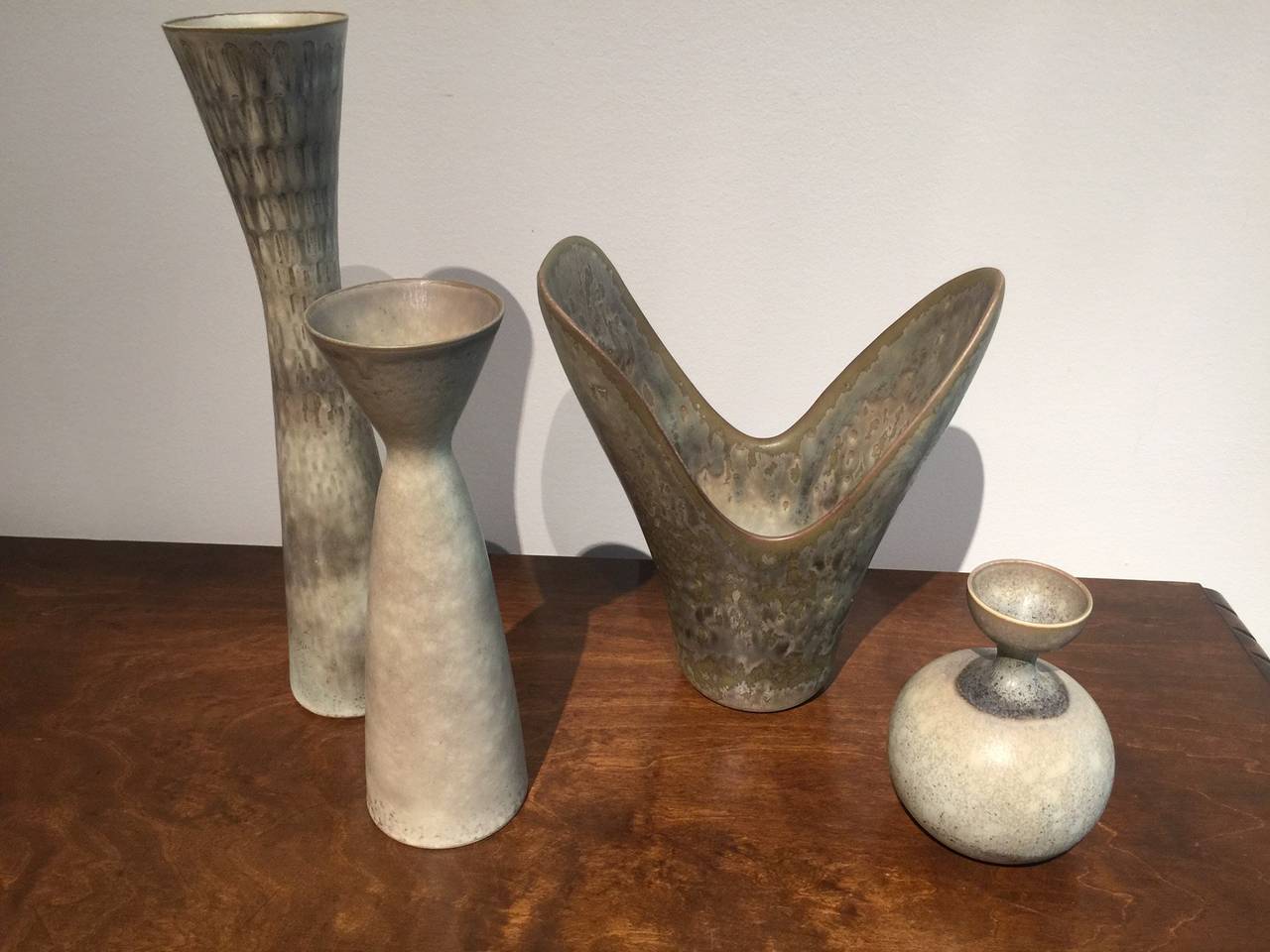 Beautiful small grouping of vases by Carl Harry Stalhane for Rörstrand, Sweden, circa 1950s. Modernist shapes in stunning grayish eggshell glazes.