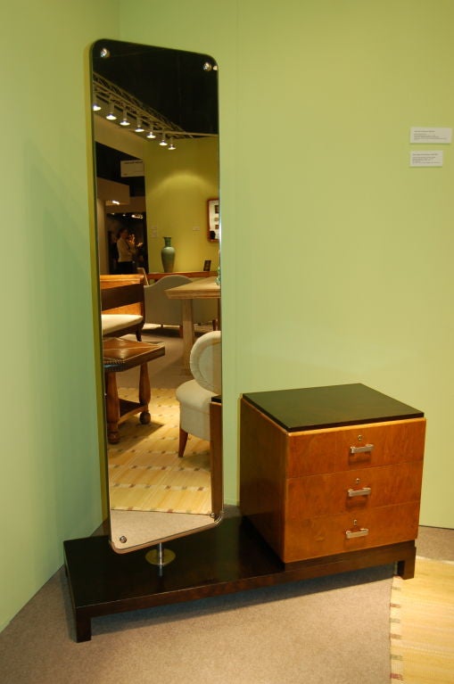 Dressing table and swivel mirror by Axel Einar Hjorth for NK, Sweden, ca. 1940.

Mirror is finished on back with darkened birch that swivels 360 degrees.

NK metal tag attached underside.