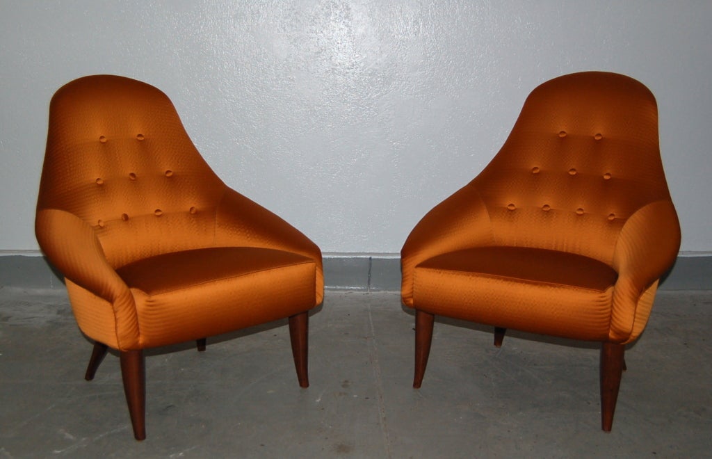 Pair of upholstered chairs by Kersten Horlin Holmquist for NK, ca. 1955.<br />
Reupholstered in elegant sateen fabric with darkened legs.<br />
28