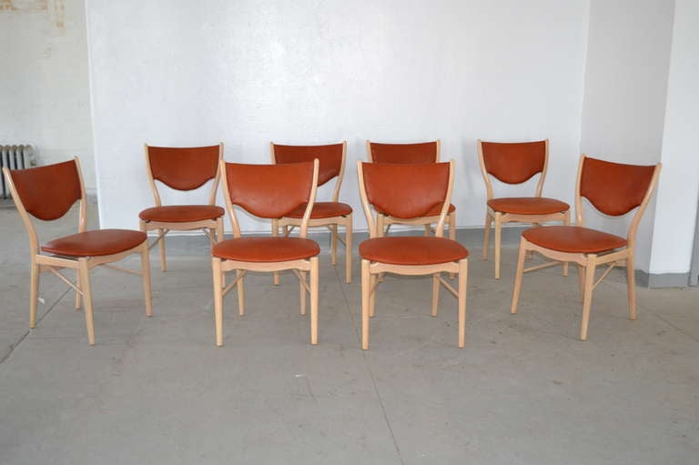 Set of eight dining chairs designed by Finn Juhl, made by Bovirke, Denmark ca. 1960. Lightened beech with leather upholstery.