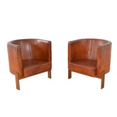 Pair of chairs in patinated leather by Erik Karlström