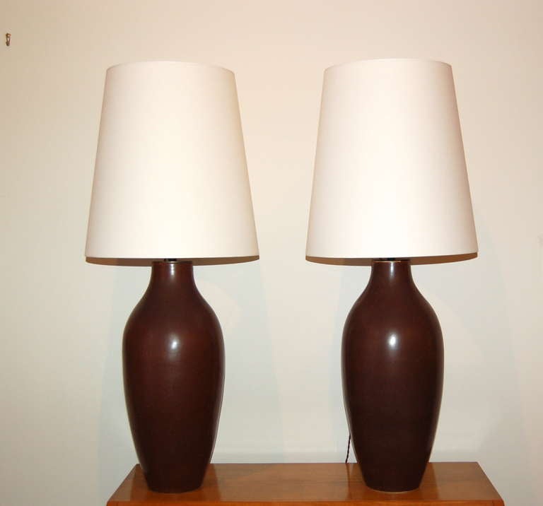 Pair of monumental ceramic lamps by Carl harry Rorstrand of Sweden for Rorstrand. Artist signed with factory marks, Circa. 1950.

Rewired with new shades and sockets.

23