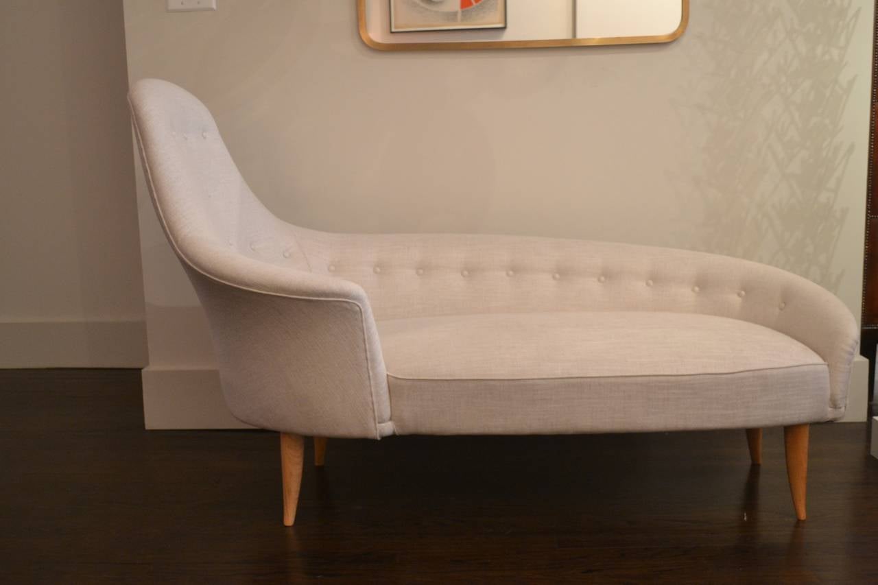 Sculptural chaise lounge by Swedish designer Kerstin Hörlin-Holmquist.
Produced by Nordiska Kompaniet in the mid-1950s.
New upholstery.

Measures: 61” L x 31” W x 39.5” H at back.
Seat H: 17”.