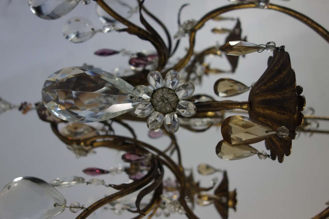 A lovely French gilded metal and crystal chandelier for candles. Can easily be electrified should one desire.