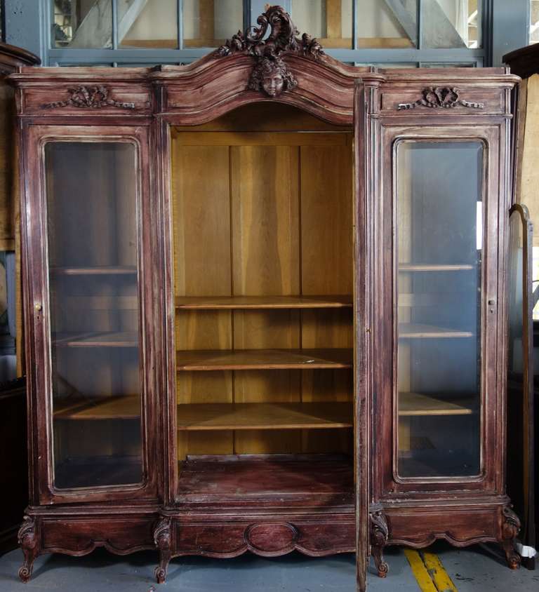 A gorgeous French triple armoire with adjustable shelves.
