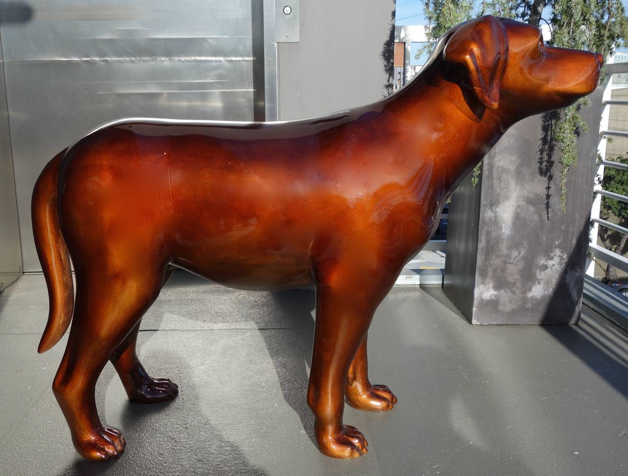 This is a life sized chocolate lab sculpture by noted San Francisco artist, Sandro Tchikovani. Made of fiberglass and painted in this delicious chocolate color. Man's best friend ! House-trained and obedient.
