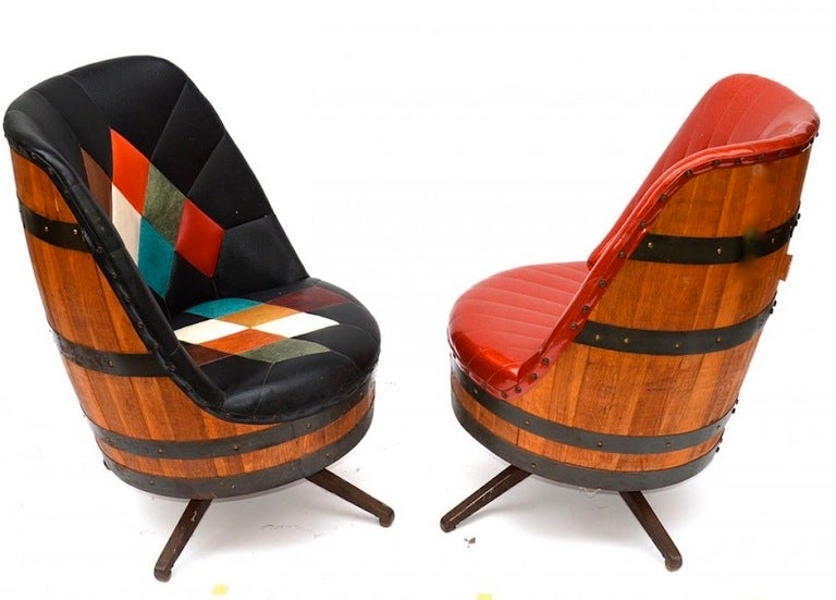 A whimsical pair of swivel barrel chairs if a harlequin design. Ideal for a game room where you need a punch of color and whimsy.