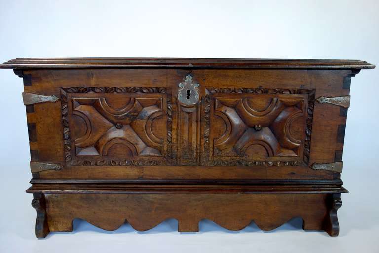 A beautifully time worn Spanish walnut trunk. This piece was purchased in Barcelona in the 60s and has been privately held since that time. Beautiful carving and hardware.