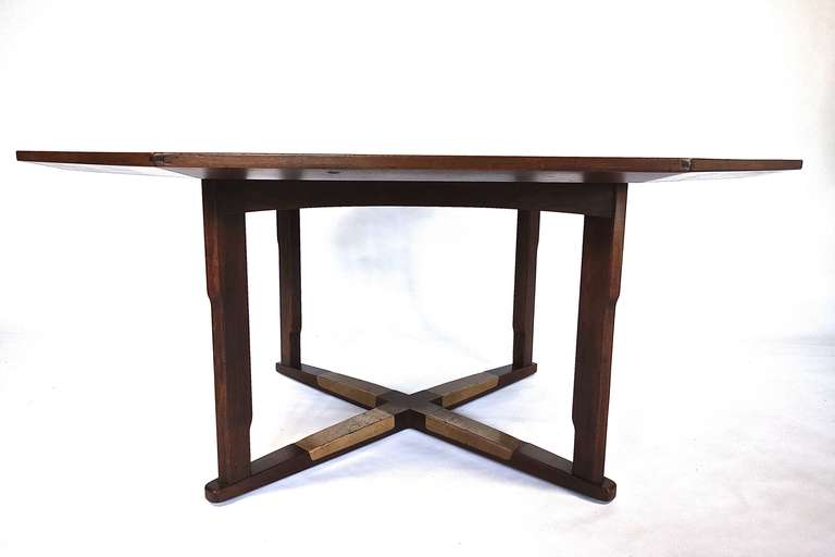 A beautifully made octagon-shaped walnut game by Edward Wormley for Dunbar. The top features a star-shaped inlay of rosewood and the base is clad in leather. There's room for all your mates at this table.

Additional dimensions: Sides alternate