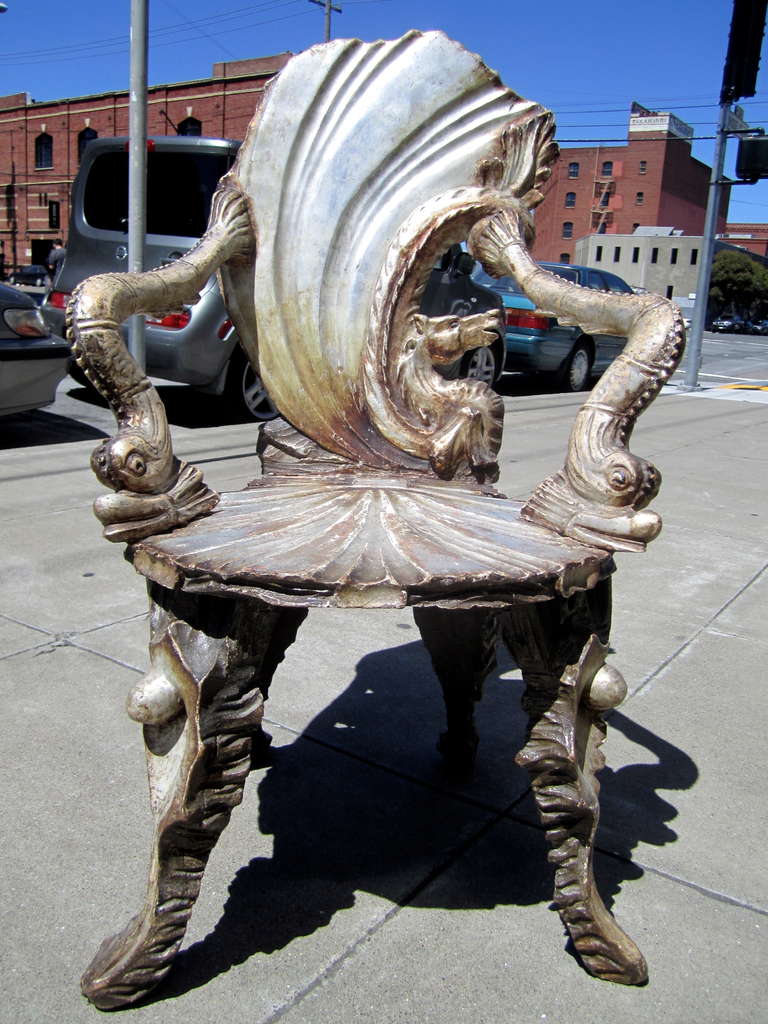 An exceptionally rare pair of Pauly et Cie. grotto chairs with sweeping backs embellished with carved seahorses. This represents a supremely unique purchase opportunity for the discriminating collector.

PROVENANCE: Aileen Getty private