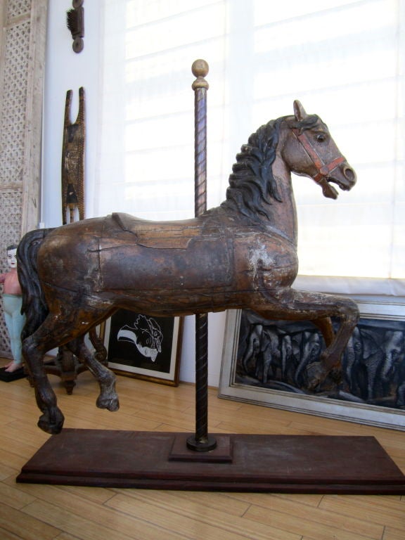Brilliant carousel horse on stand.