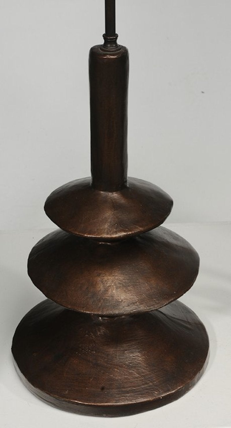 A beautifully patinated pair of copper resin Giacometti style lamps for Sirmos.